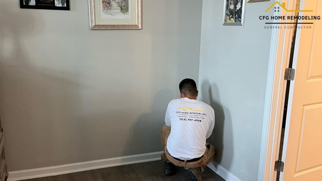 Local drywall repair professional fixing damaged walls and matching textures inside a home in Durham, North Carolina.